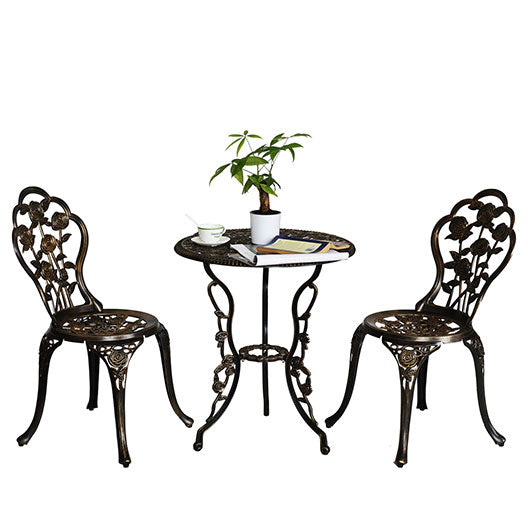 Cast aluminium three-piece bistro set: two ornate chairs and a matching round filigree table
